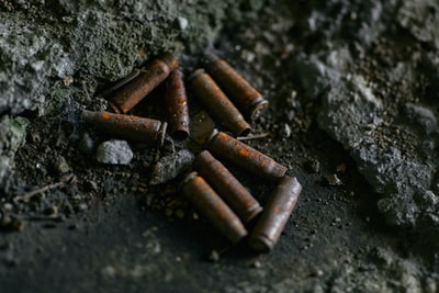 Black on the surface of a brown cigarette butts
